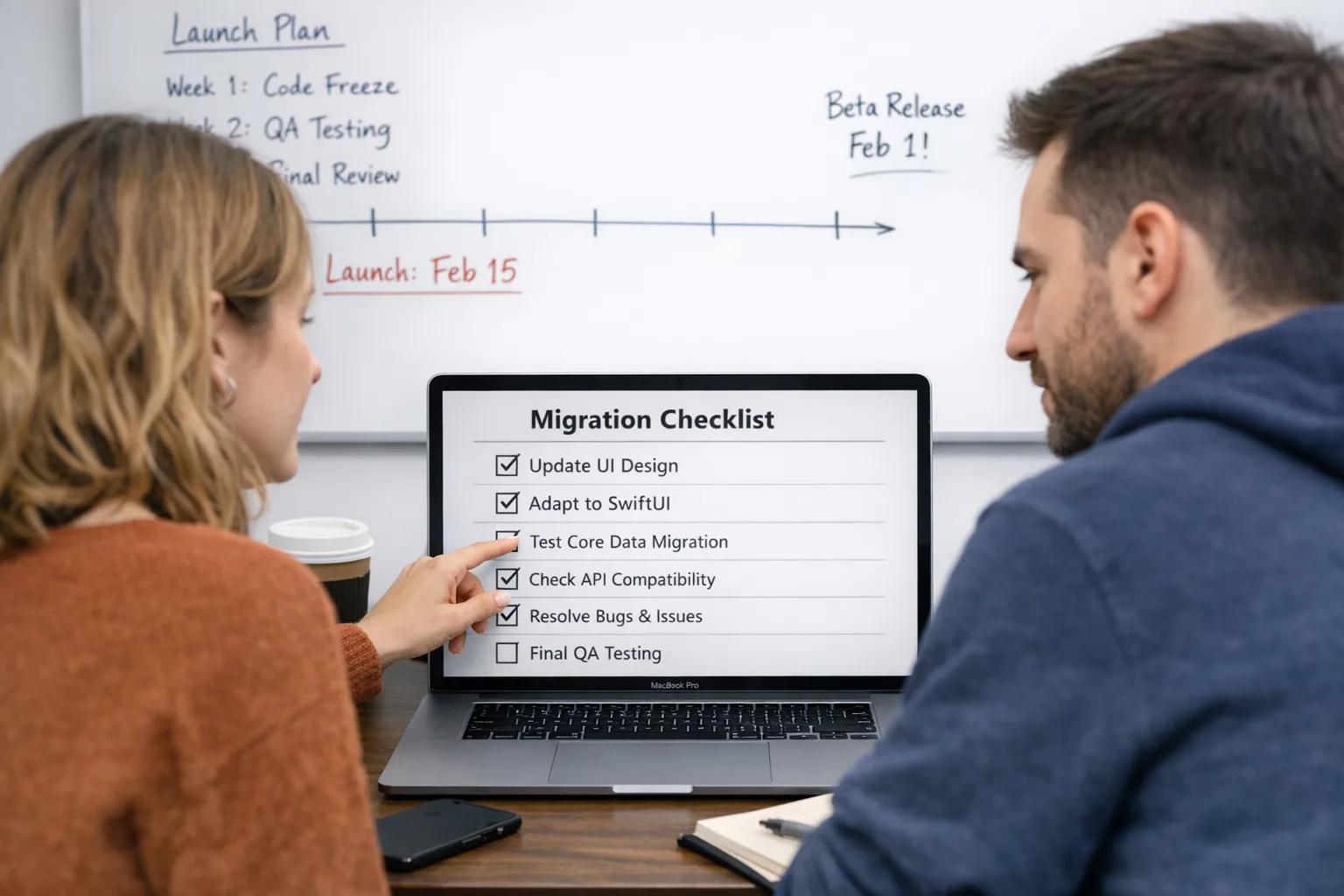 Developers planning the Xcode 26 migration on a whiteboard